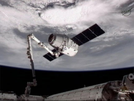 SpaceX Dragon docks with the International Space Station — the first private spacecraft ever to do so. (Credit: NASA)